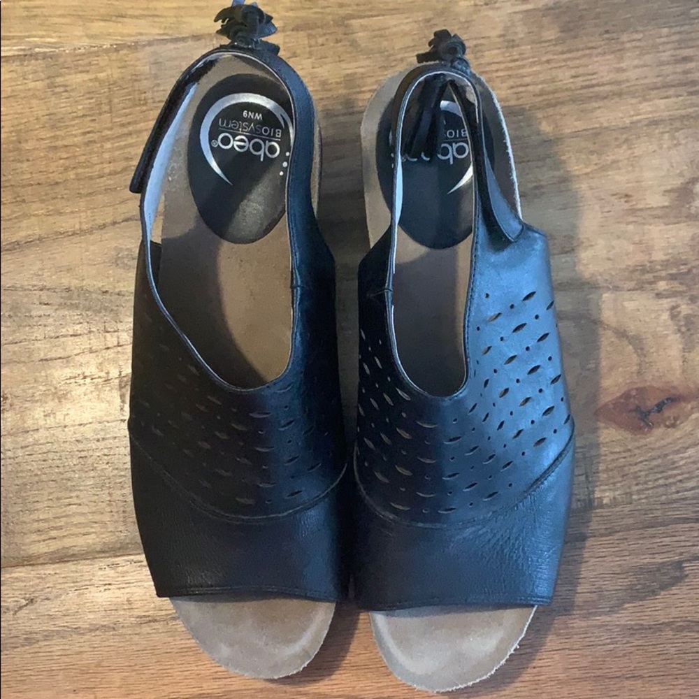 Abeo open toe sandals with tassels.